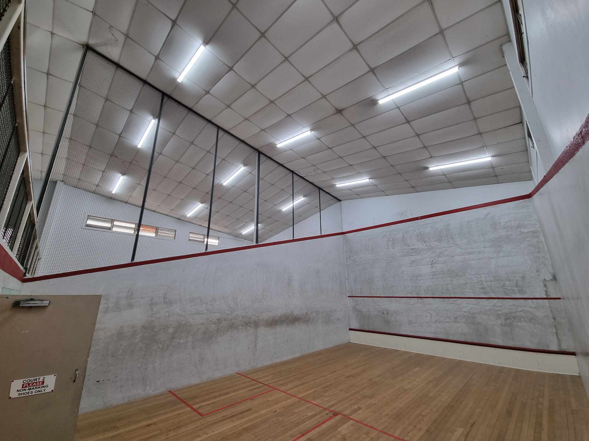 Industrial lighting installed in squash club courts